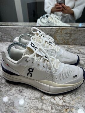 On THE ROGER Pro White Indigo 
Speedboard Women's Tennis Shoes